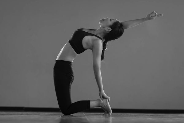 A sequence of images showing the progression of a yoga pose, emphasizing flow and control.